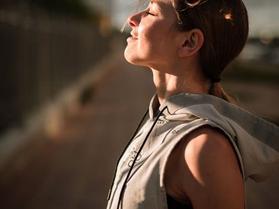 Man in sports wear taking a deep breath after session
